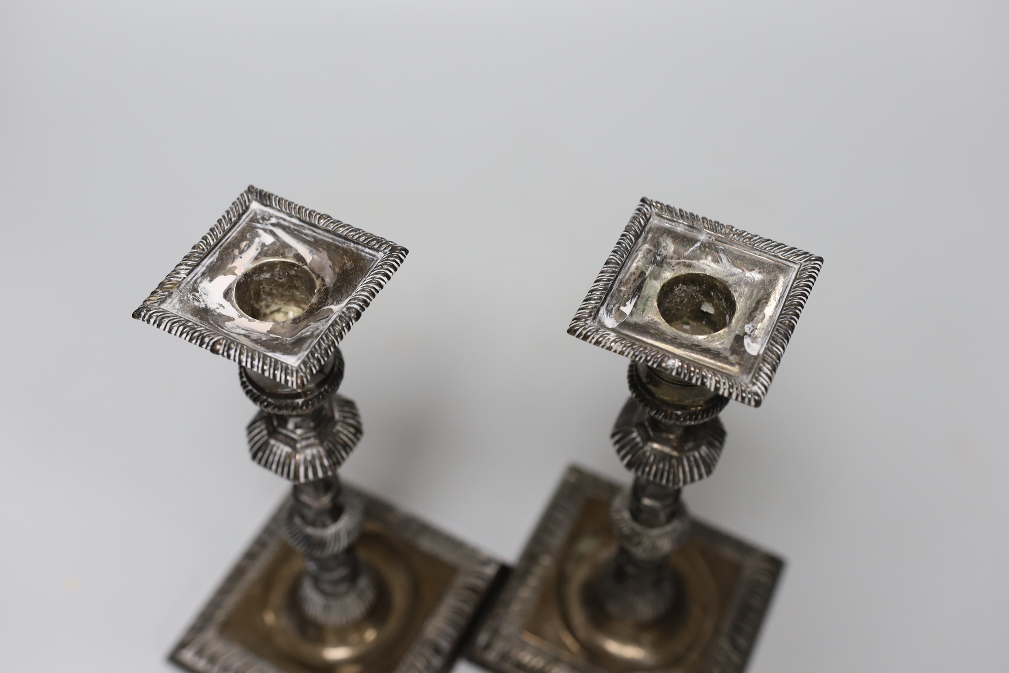A pair of late Victorian silver candlesticks, with octagonal knopped stems, Thomas Bradbury & Sons, London, 1897, height 23.4cm, weighted.